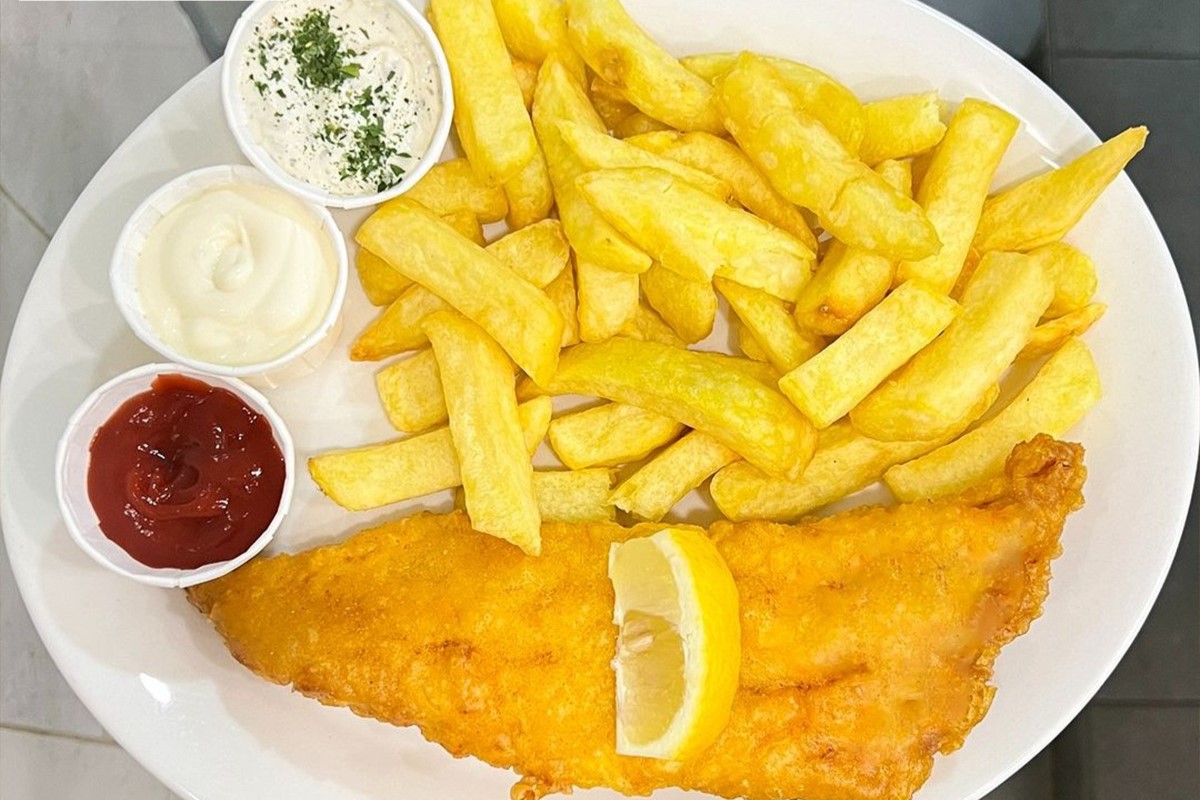 Fish and Chips with sauce served at Chippy Takeaway in West Calder